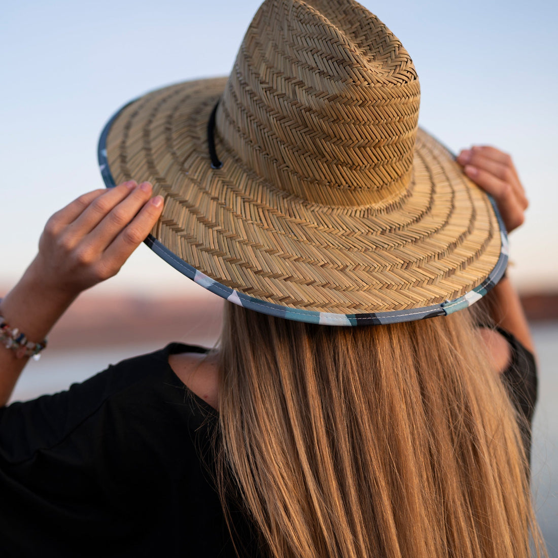 Charlee Girl wide brim straw sun hat with feminine patterned under-brim and adjustable drawstring