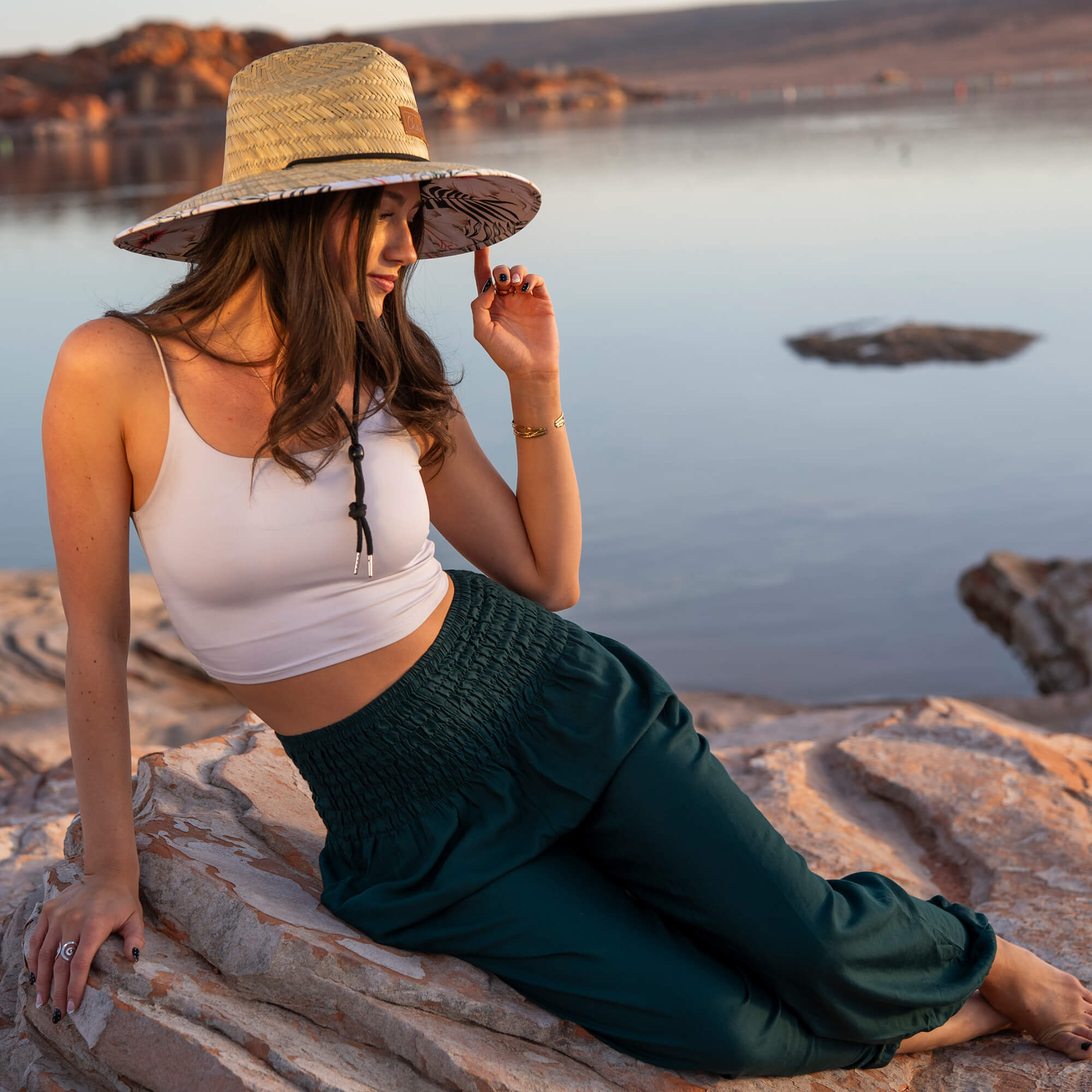 Charlee Girl flowy pants and straw hat showing thoughtful craftsmanship and natural fiber design details