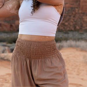 Sandstone harem pants fabric detail — soft plant-based rayon viscose