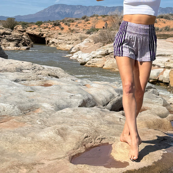 Detail view of Alignment Stripe Amethyst shorts — purple striped rayon shorts close-up