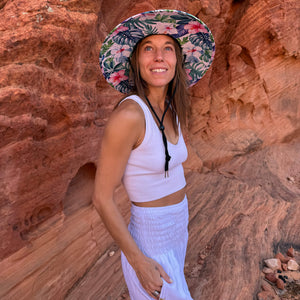 Karlene in The Tenley Hollow Mat hat with moonlight harem pants — pink hibiscus under-brim boho hat