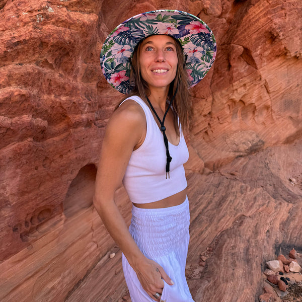 Karlene in The Tenley Hollow Mat hat with moonlight harem pants — pink hibiscus under-brim boho hat