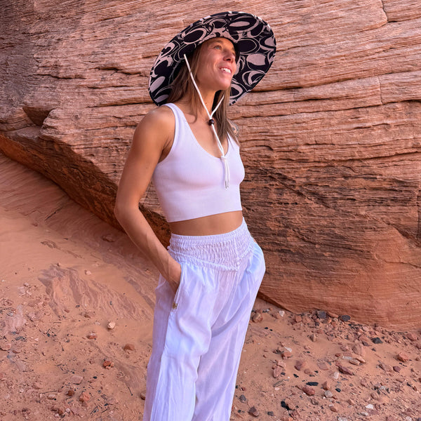 Karlene in The Ashley Rush & Mat hat and moonlight harem pants — structured lifeguard brim sun hat