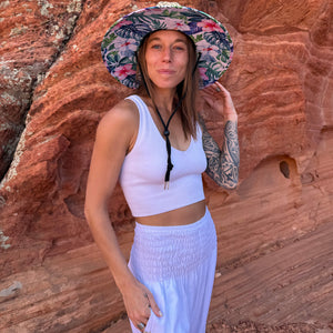 Side view of The Tenley Rush & Mat hat with moonlight harem pants — structured tropical hibiscus sun hat