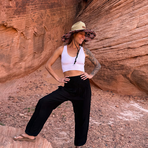 Karlene wearing The Anna Rush & Mat sun hat with harem pants — lifeguard brim boho hat