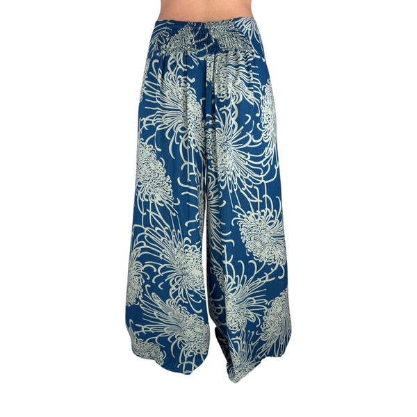 Side slit detail on Wild Bloom Azure Sky palazzo pants — blue wide leg pants
