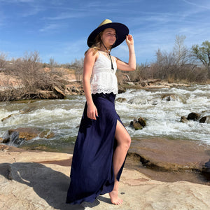 Tenley wearing The JoJo Rush & Mat hat with Ocean Wave palazzo pants — solid blue under-brim boho hat