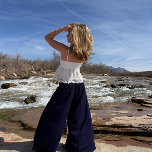 Back view of Ocean Wave palazzo pants showing elastic smocked waistband — navy palazzo pants