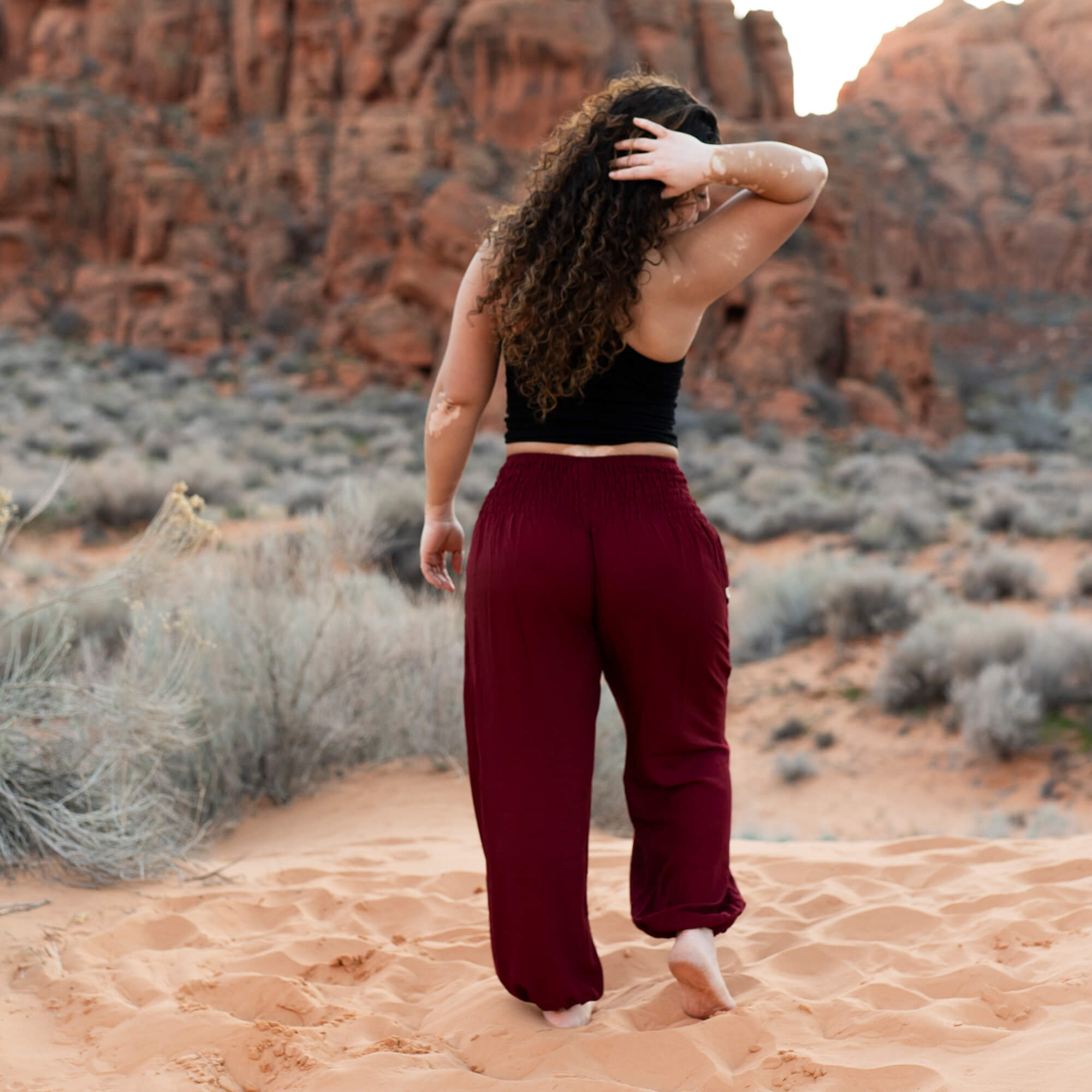 Back view of Ruby Garnet harem pants — red flowy pants women
