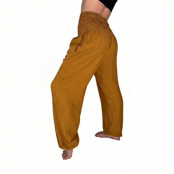 Side drape view of Amber harem pants — brown boho pants styled