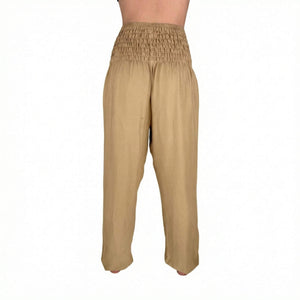 Deep hip pockets with heart logo on Creme harem pants — harem pants with pockets