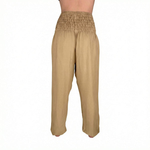 Deep hip pockets with heart logo on Creme harem pants — harem pants with pockets