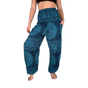 Woman wearing azure sky blue mandala harem pants — boho blue mandala pants