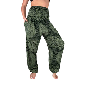 Woman wearing forest moss green mandala harem pants — boho green mandala pants