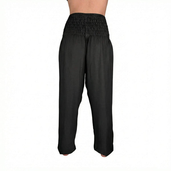 Deep hip pockets with heart logo on Obsidian Black harem pants — harem pants with pockets