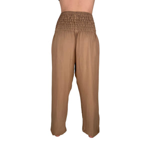 Deep hip pockets with heart logo on Sandstone harem pants — harem pants with pockets