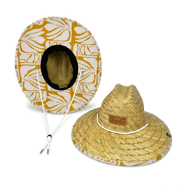 Woman wearing The Charlee Hollow Mat sun hat — tropical leaf open weave hat