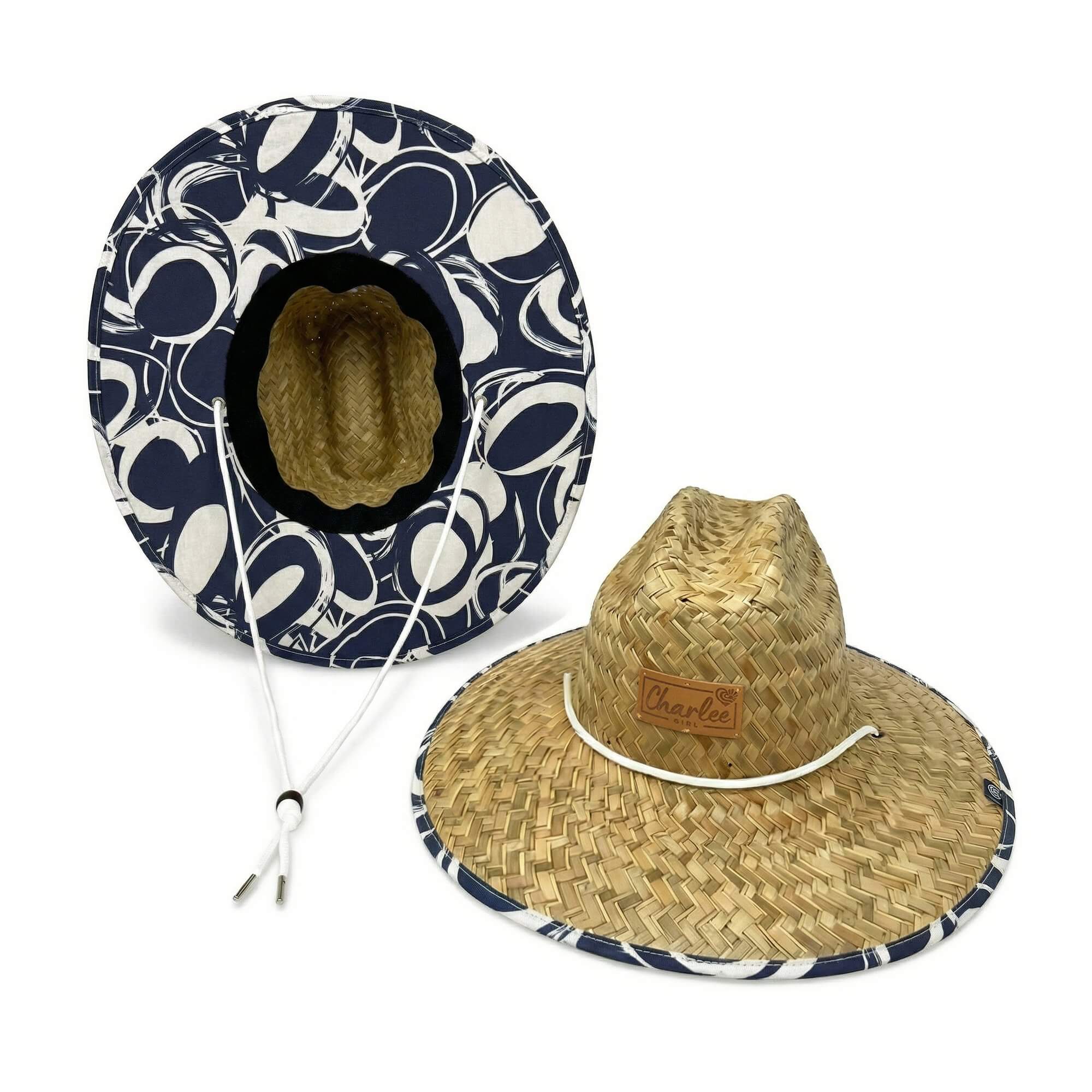 Woman wearing The Ashley straw sun hat — navy abstract print boho beach hat
