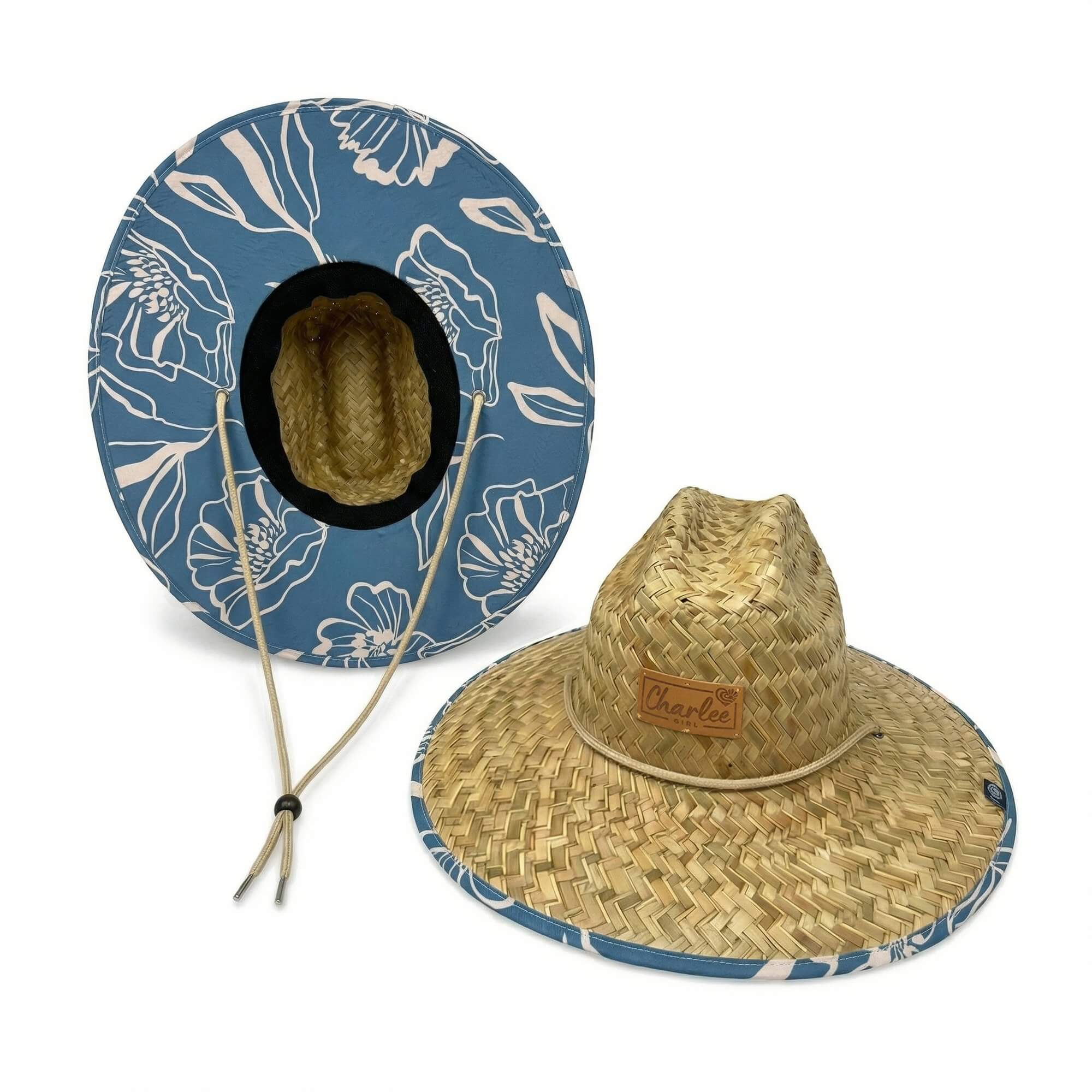 Woman wearing The Emery straw sun hat — blue floral boho beach hat