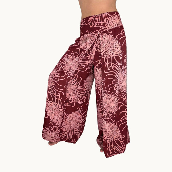 Woman wearing red floral palazzo pants — boho wide leg pants