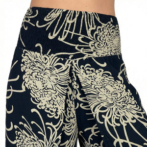 Side slit detail on Wild Bloom Obsidian palazzo pants — black wide leg pants