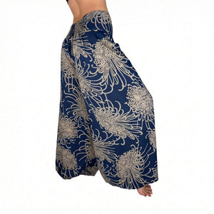 Woman wearing navy floral palazzo pants — boho wide leg pants