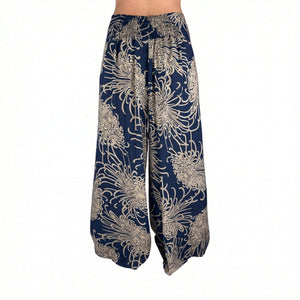 Side slit detail on Wild Bloom Ocean Wave palazzo pants — navy wide leg pants