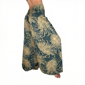 Woman wearing brown floral palazzo pants — boho wide leg pants