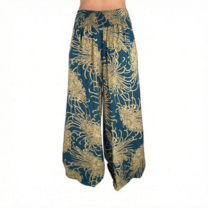 Side slit detail on Wild Bloom Rooted Earth palazzo pants — brown wide leg pants