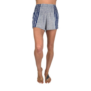 Woman wearing ocean wave navy printed shorts — boho printed shorts outfit