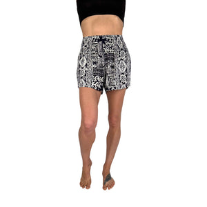 Woman wearing ocean wave navy printed shorts — boho printed shorts outfit
