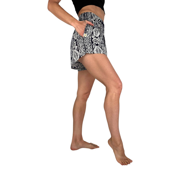 Smocked waistband on Ember Glyph Ocean Wave shorts — navy geometric shorts